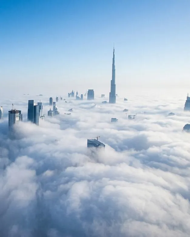 Dubai skyline above the clouds